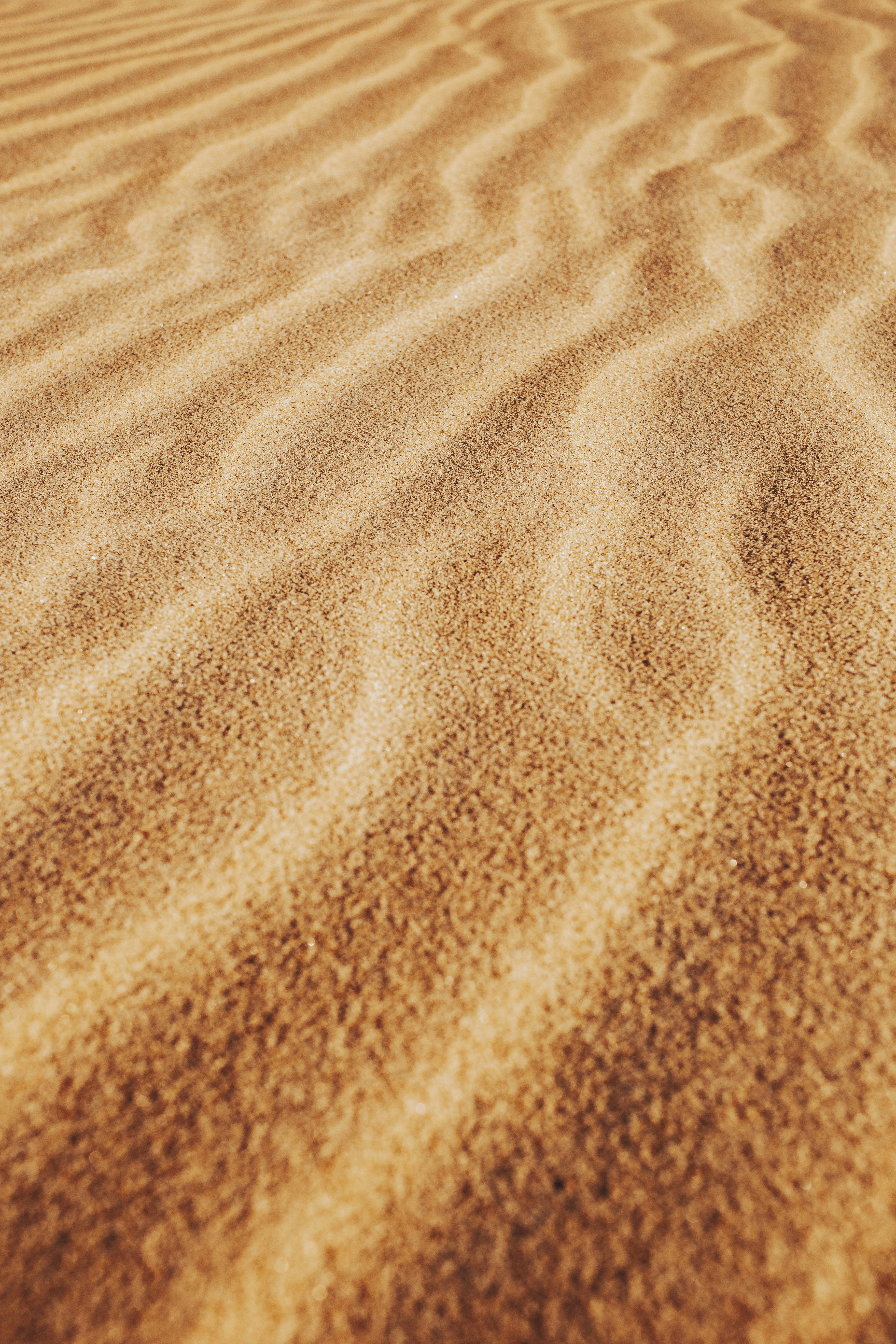 brown sand with shadow of person